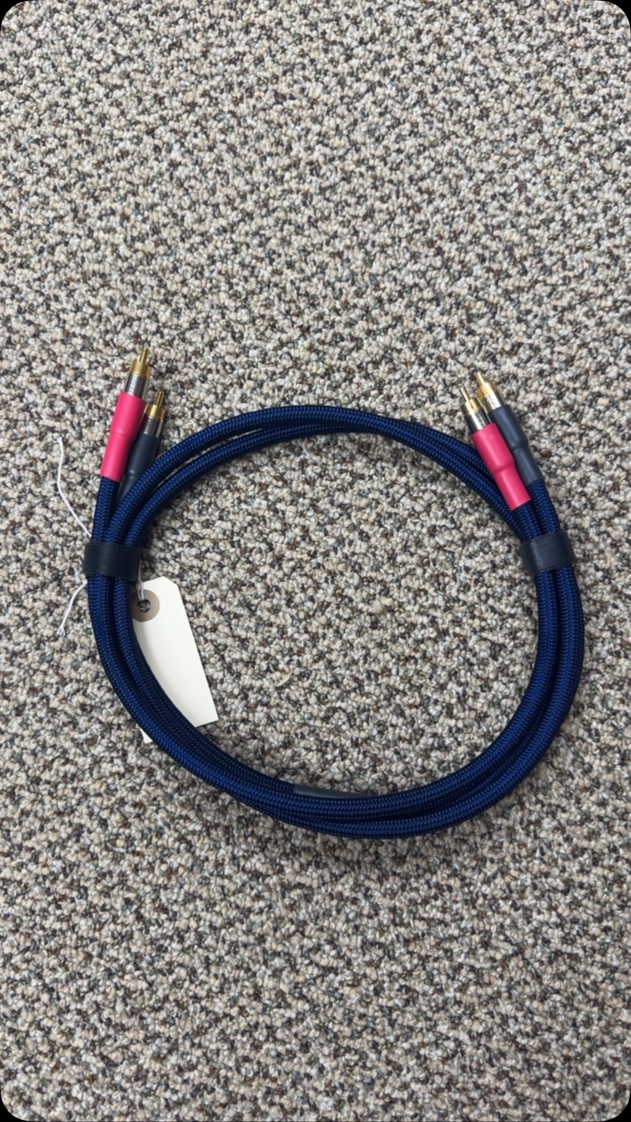 Blue braided Speakerworks audio cables with red and black connectors