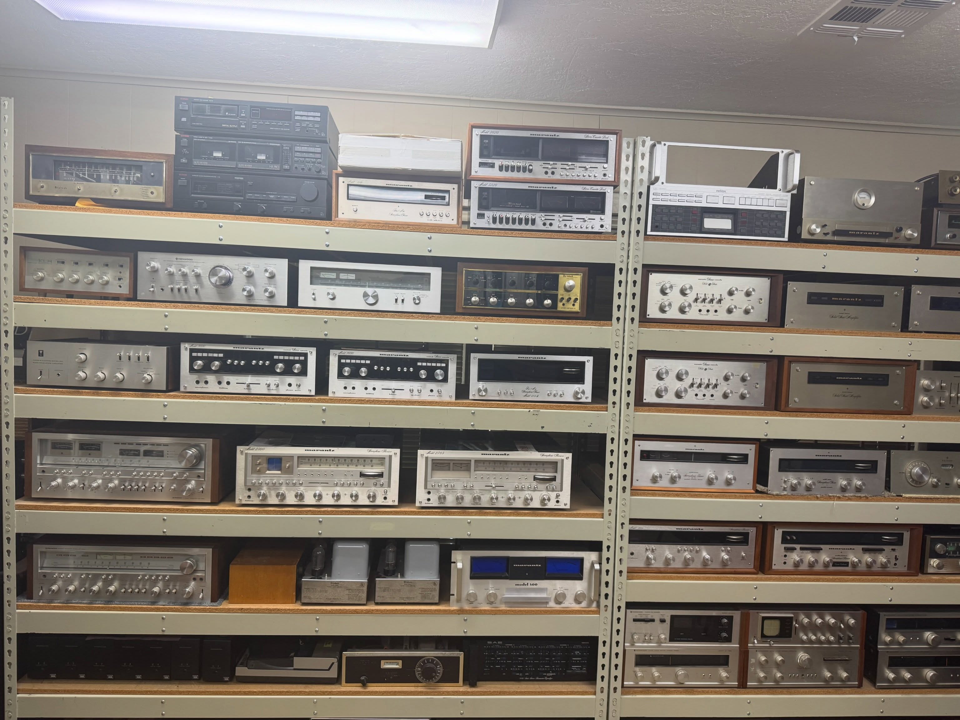 Shelves of vintage receivers and amplifiers at Speakerworks